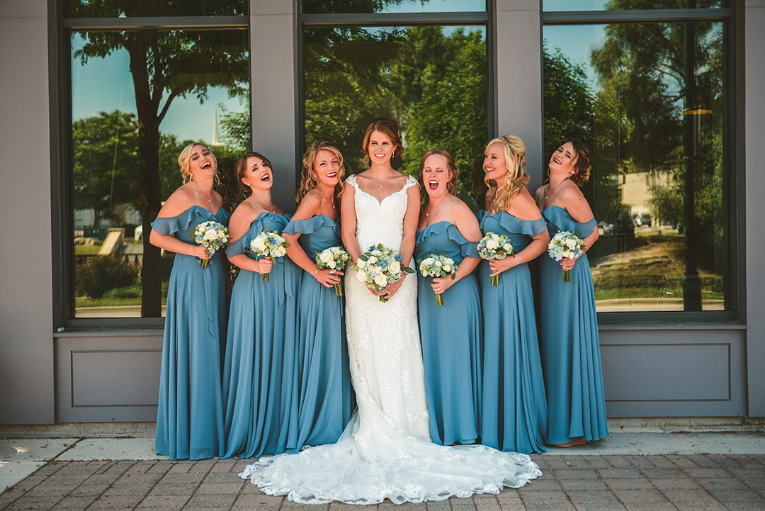 the bridesmaids laughing as the bride said something funny