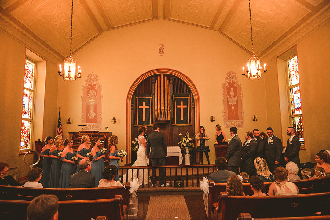 a wedding taking place at The Old Stone Church in Lockport