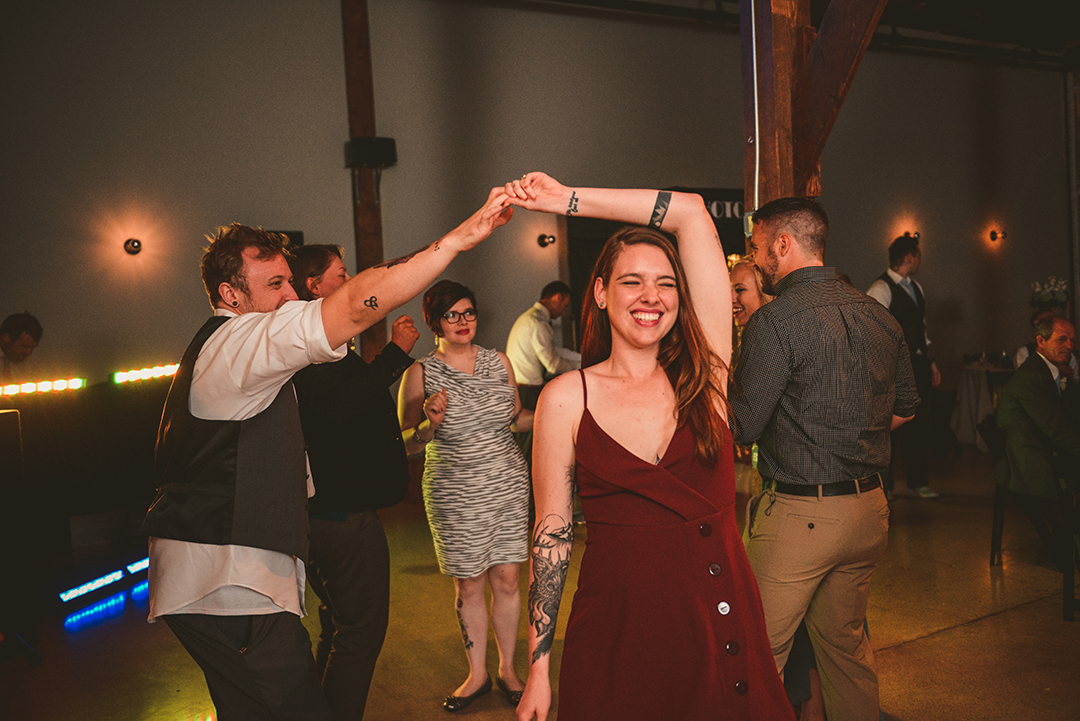 a man and a woman dancing at Warehouse 109 while laughing