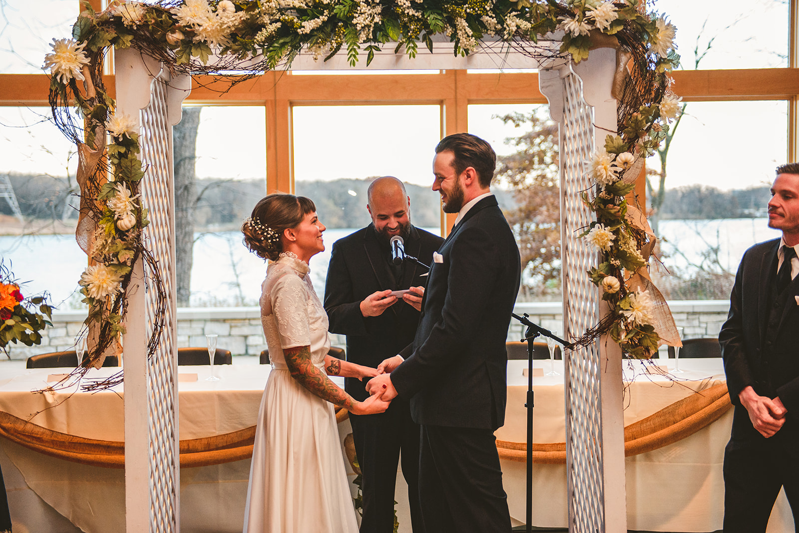 a bride and groom looking into each others eyes while smiling and laughing at the Four Rivers Environmental Education Center in Channahon