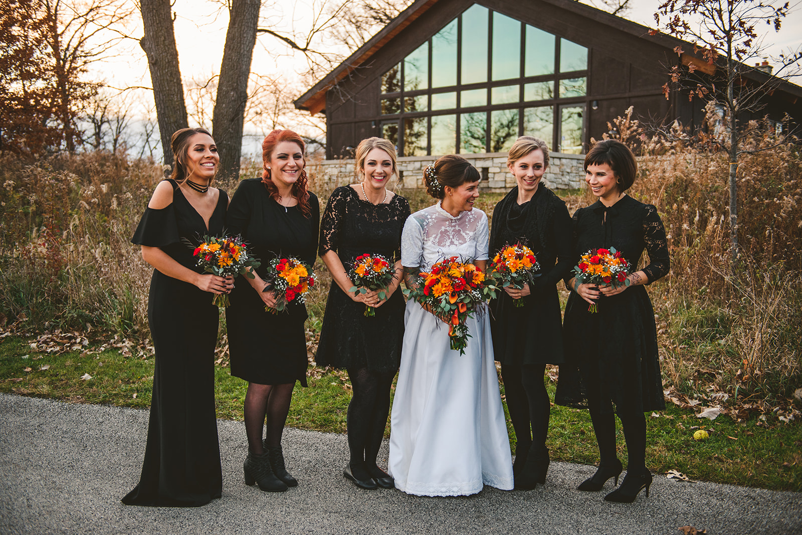 the bride and the bridesmaids laughing in the back of the Four Rivers Environmental Education Center