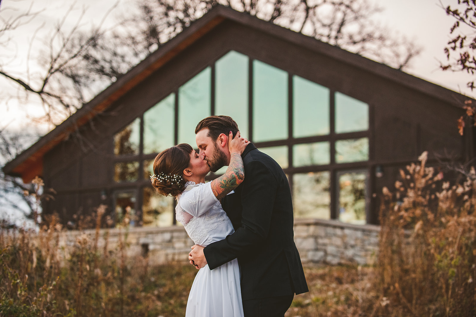 a bride and groom kissing while finally being married at the Four Rivers Environmental Education Center