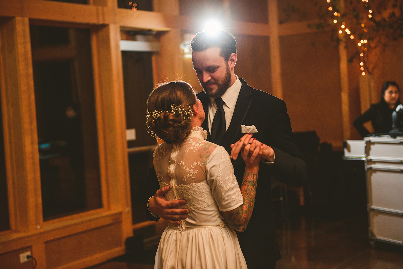 a groom looking into the eyes of his bride as they dance for the first time as husband and wife at the Four Rivers Environmental Education Center