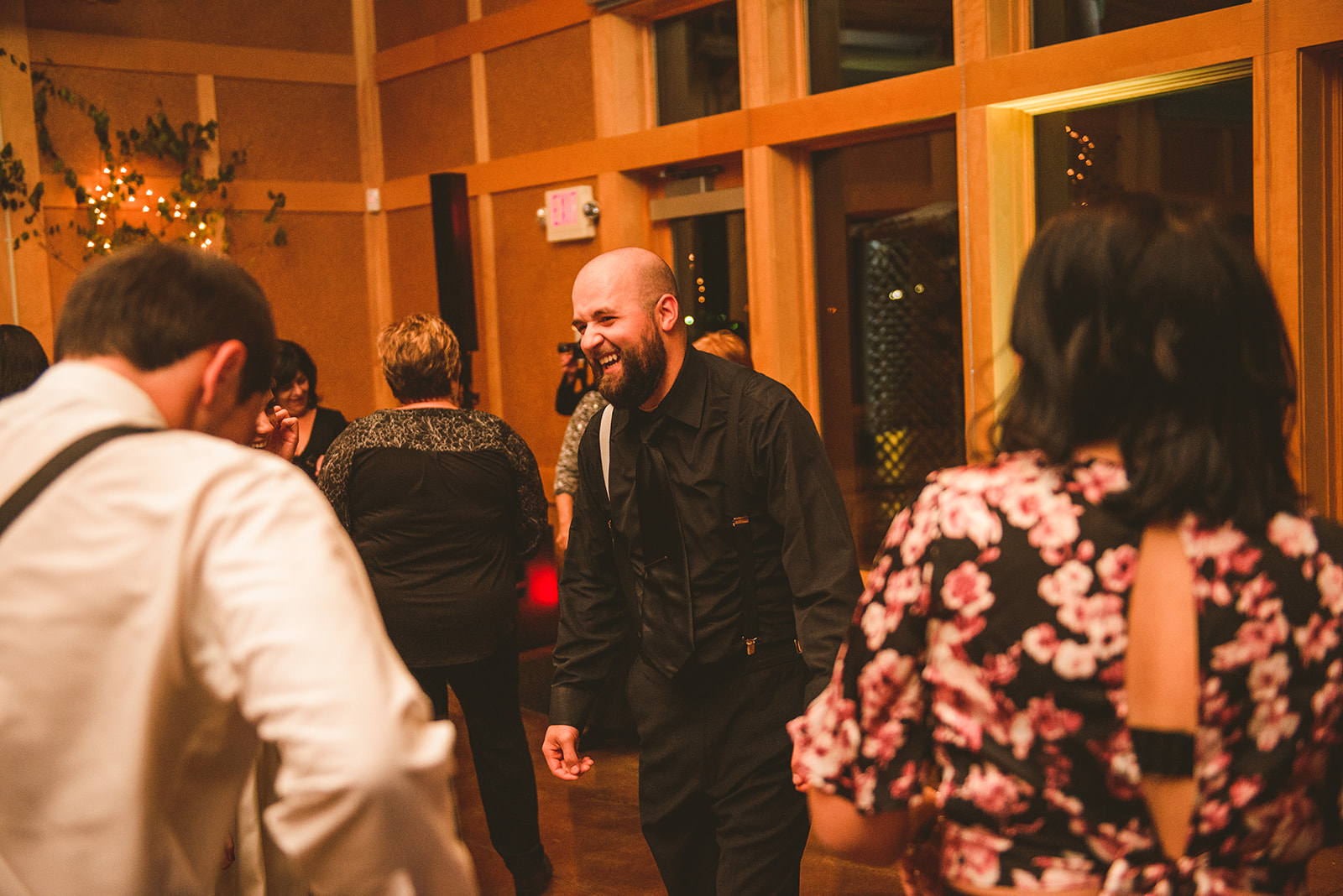 a man dancing on the dance floor as he laughs at the Four Rivers Environmental Education Center