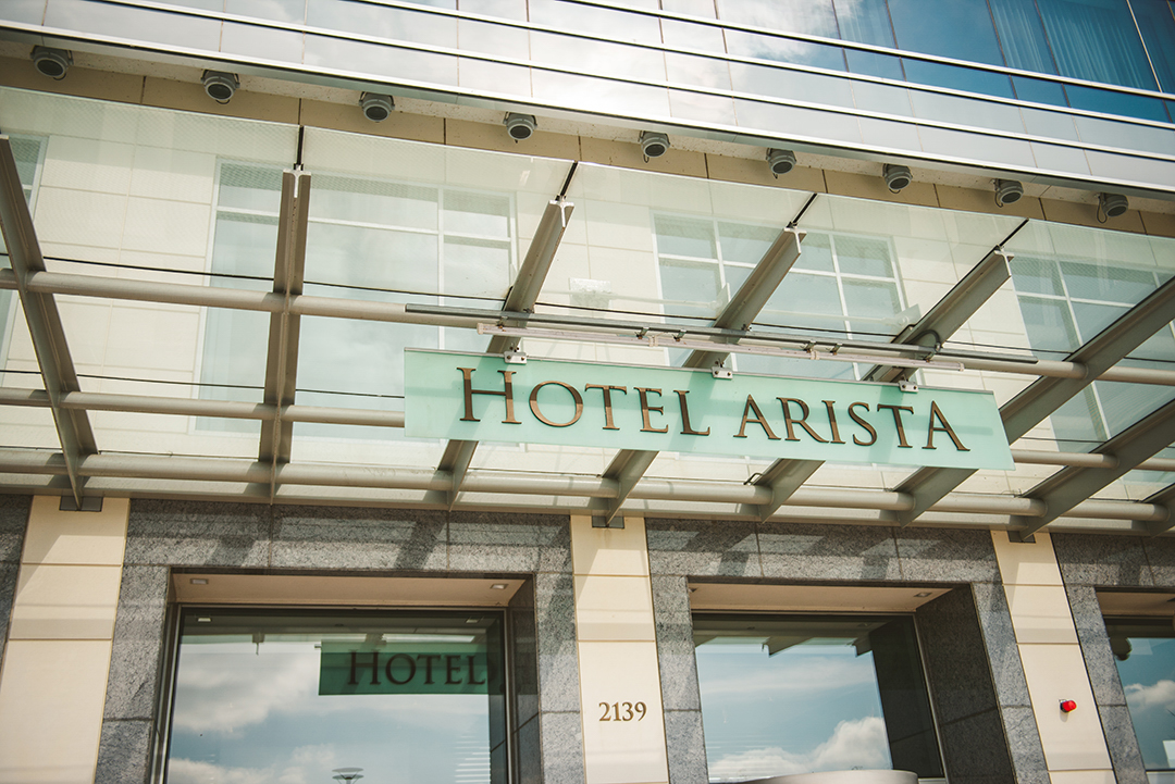 the light blue sign of at the Hotel Arista in Naperville