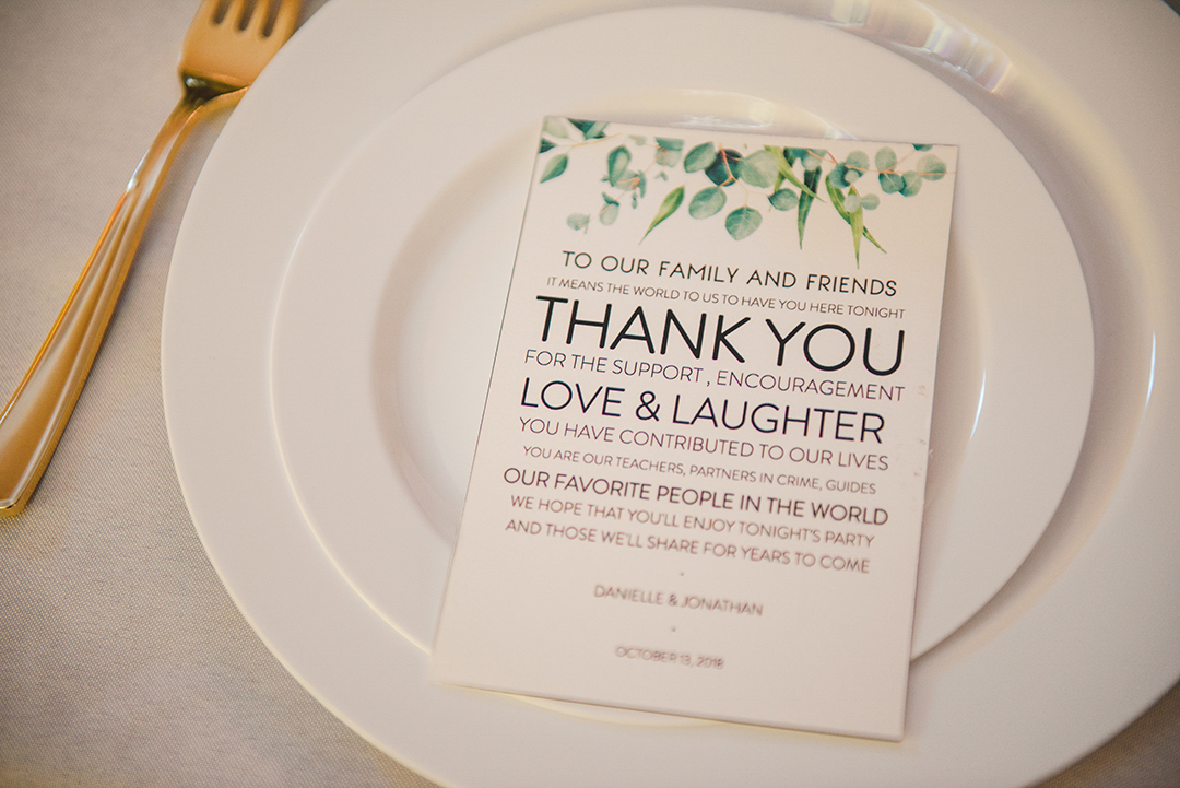 a thank you card on a plate setting at a downtown Naperville wedding reception