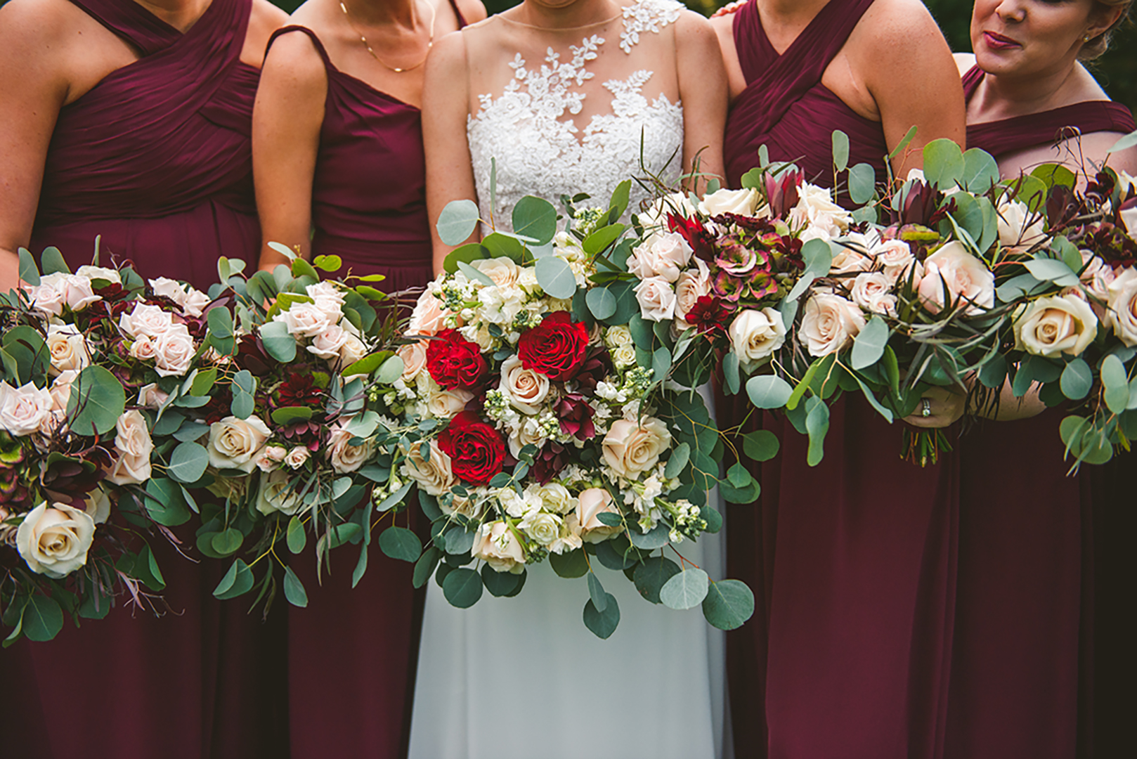 a bride and bridesmaids holding live flower bouquets at a Cantigny Park wedding