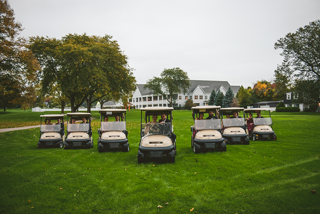 a bride party driving their golf carts in a v at a Cress Creek Country Club wedding in Naperville