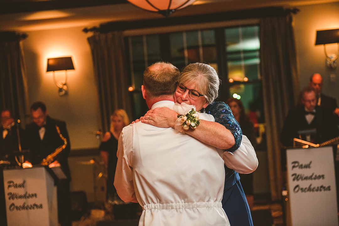 a mom hugging her son during their dance at the Cress Creek Country Club in Naperville