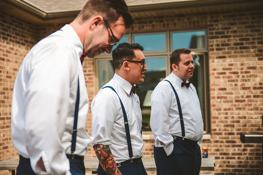 the groomsmen standing around talking before a wedding in Lockport