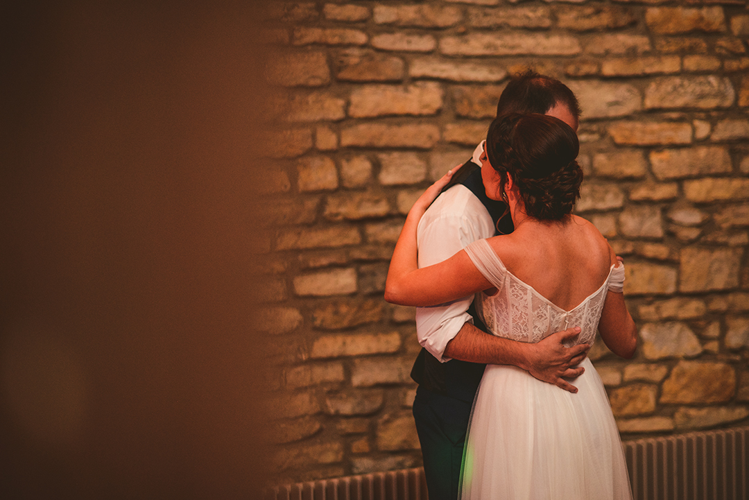 a candid image of a bride and groom experiencing their first dance at a historic building in Lockport IL