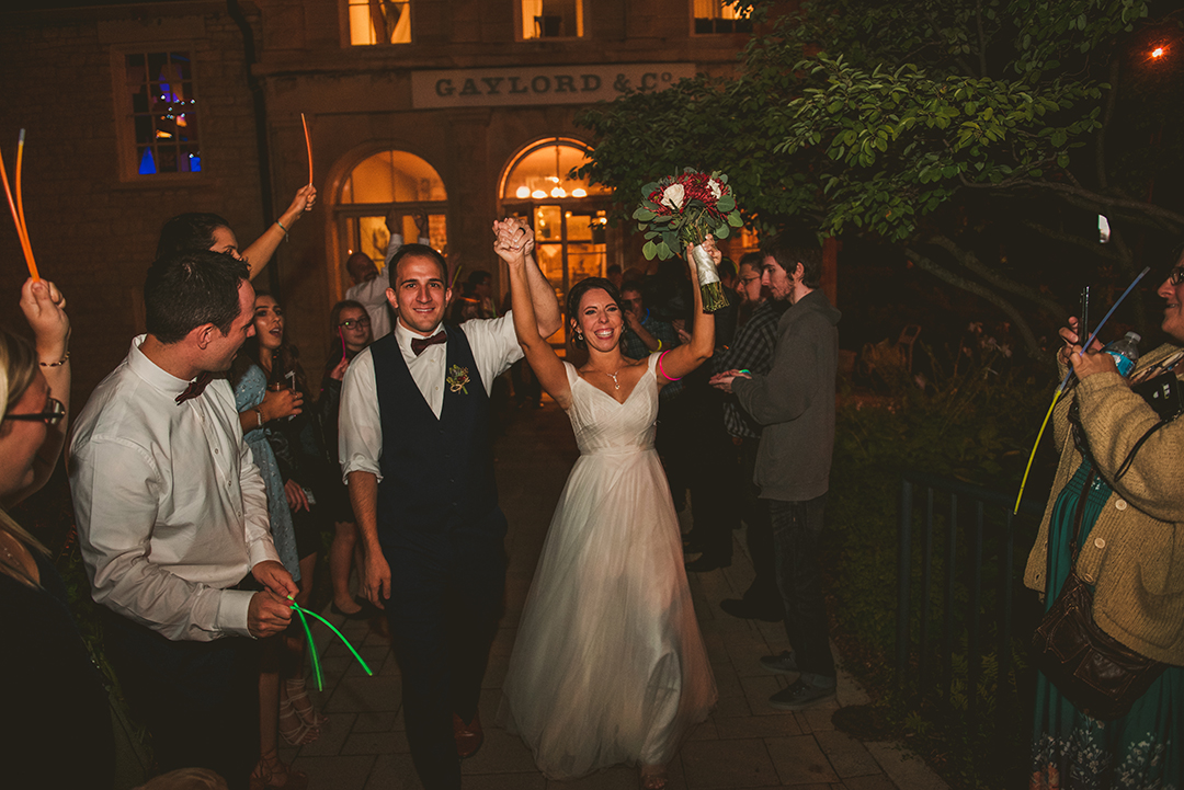 a bride and groom leaving the Public Landing after getting married in the evening