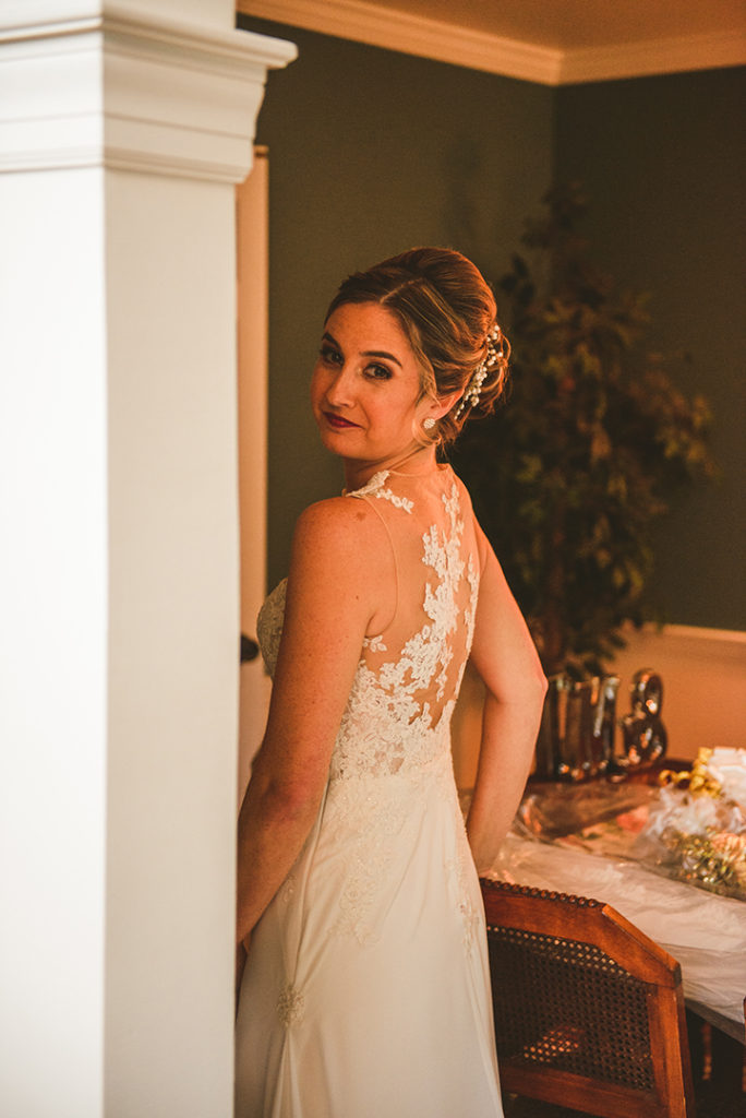 a groom looking back at the camera as she gets ready to leave for her wedding