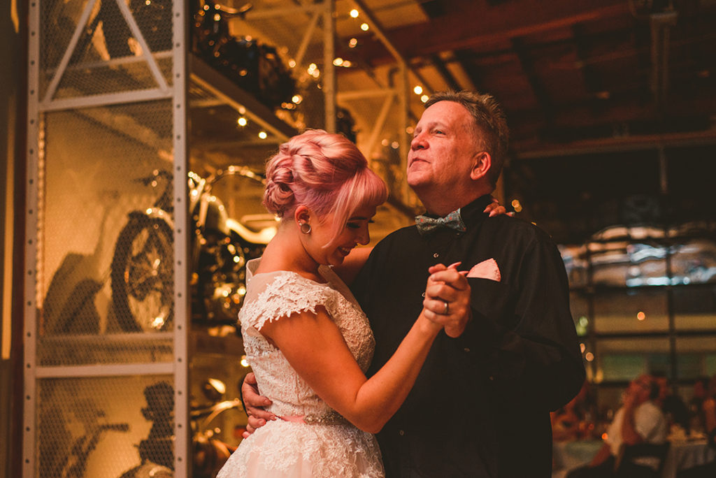 a tattooed bride dancing with her father at the Warehouse 109 in Plainfield