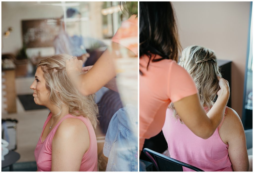 A hair stylist doing a brides hair at Society 57 in Aurora