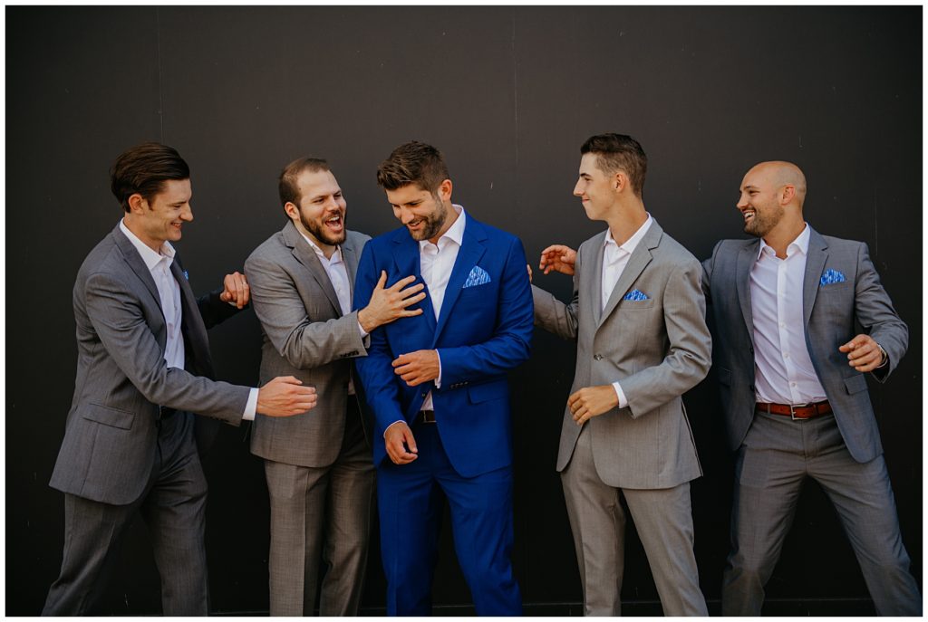 the groomsmen giving the groom a hard time before his wedding at Society 57 in Aurora
