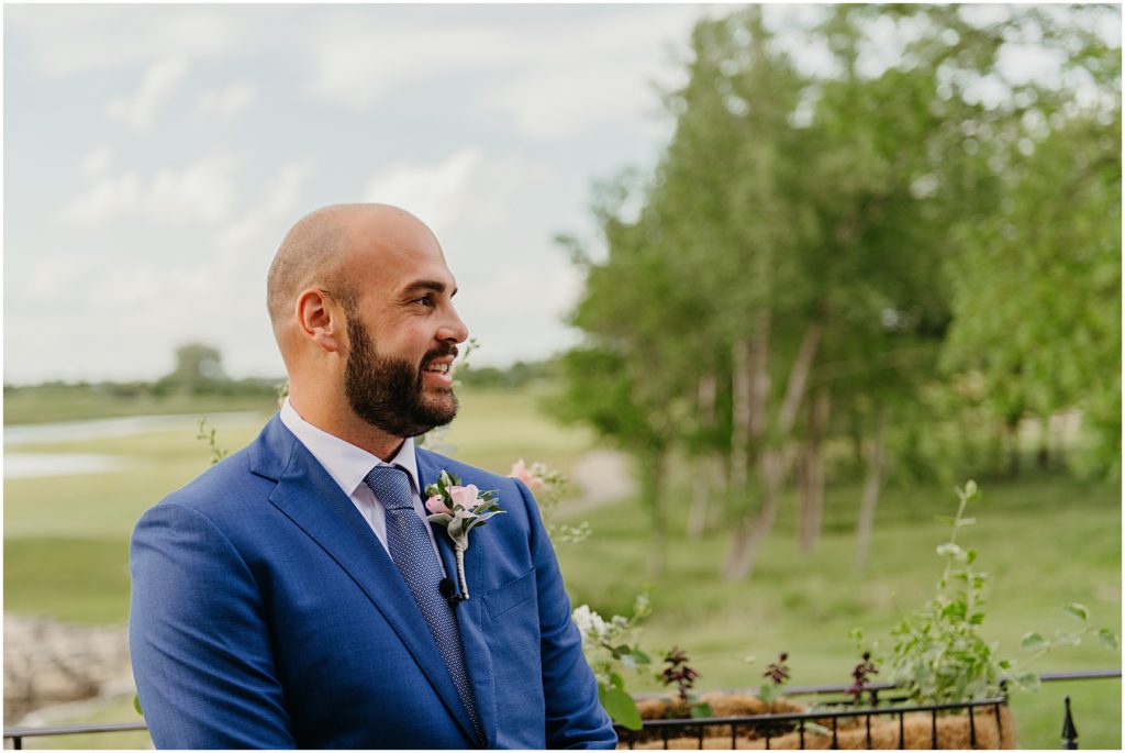 the groom seeing his bride for the first time at their micro wedding at Mistwood in Romeoville