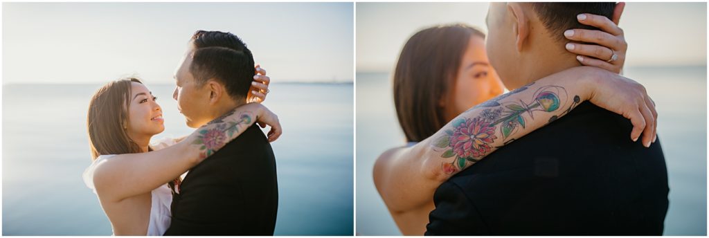 a tattooed bride hugging her groom at sunrise at the Chicago Lakefront