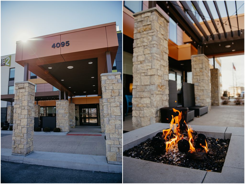 a fire pit and the main entry way at Suites by Hilton in the winter