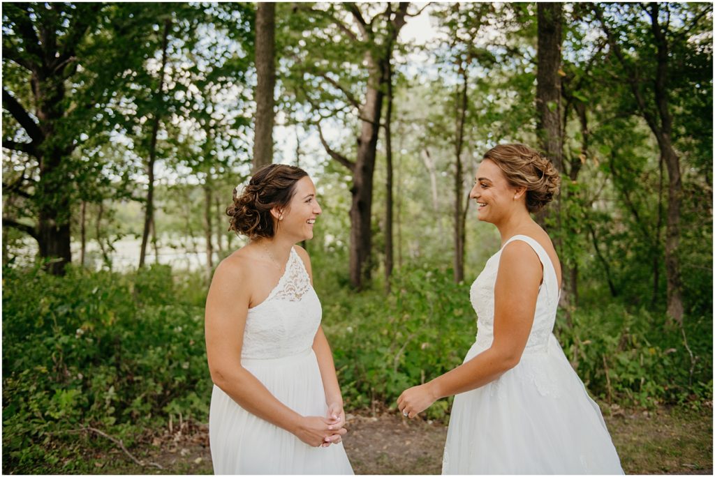 a bride laughing as she sees her bride for the first time at their intimate wedding