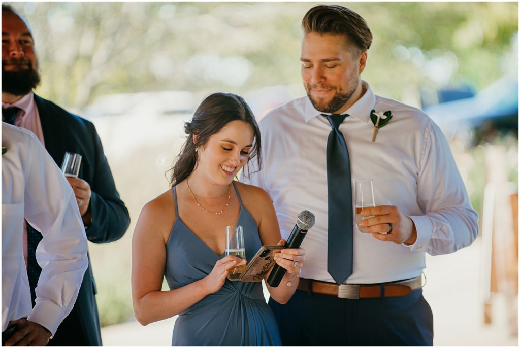 the maid of honor giving a speech during a wedding reception