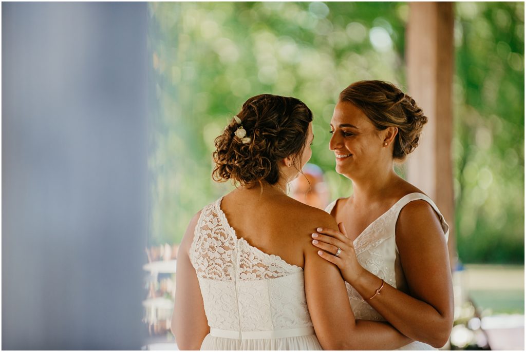 a bride looking into her brides eyes during their first dance