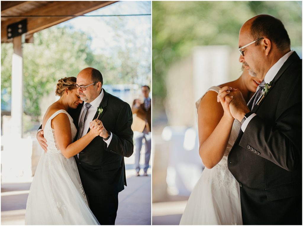 the father of the bride swinging his daughter as they dance 